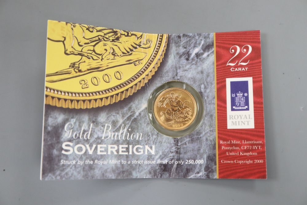 A 2000 gold sovereign, in Royal Mint packet.